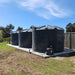 Three Polymaster 22500L Round Rainwater Tanks in Dark Blue