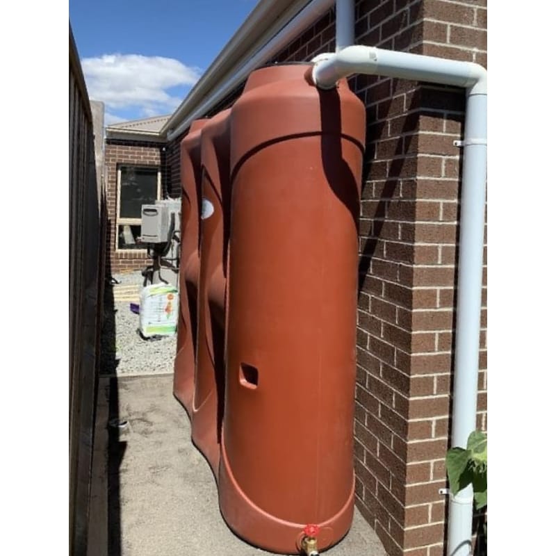 Polymaster Slim Tank Real Life Image Beside A House